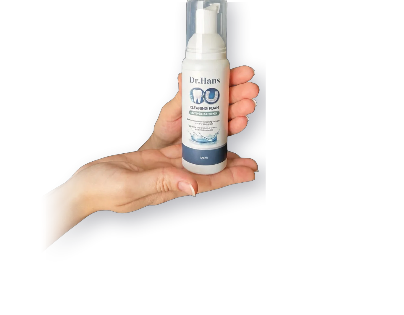 Hand holding a Dr.Hans foam bottle