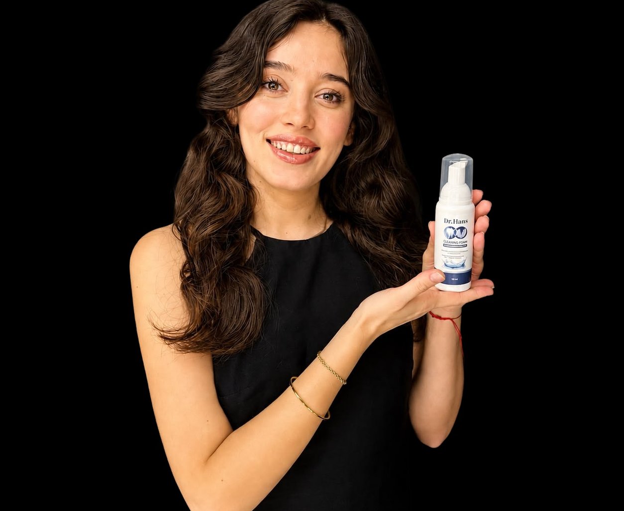 Woman showing a Dr.Hans foam bottle