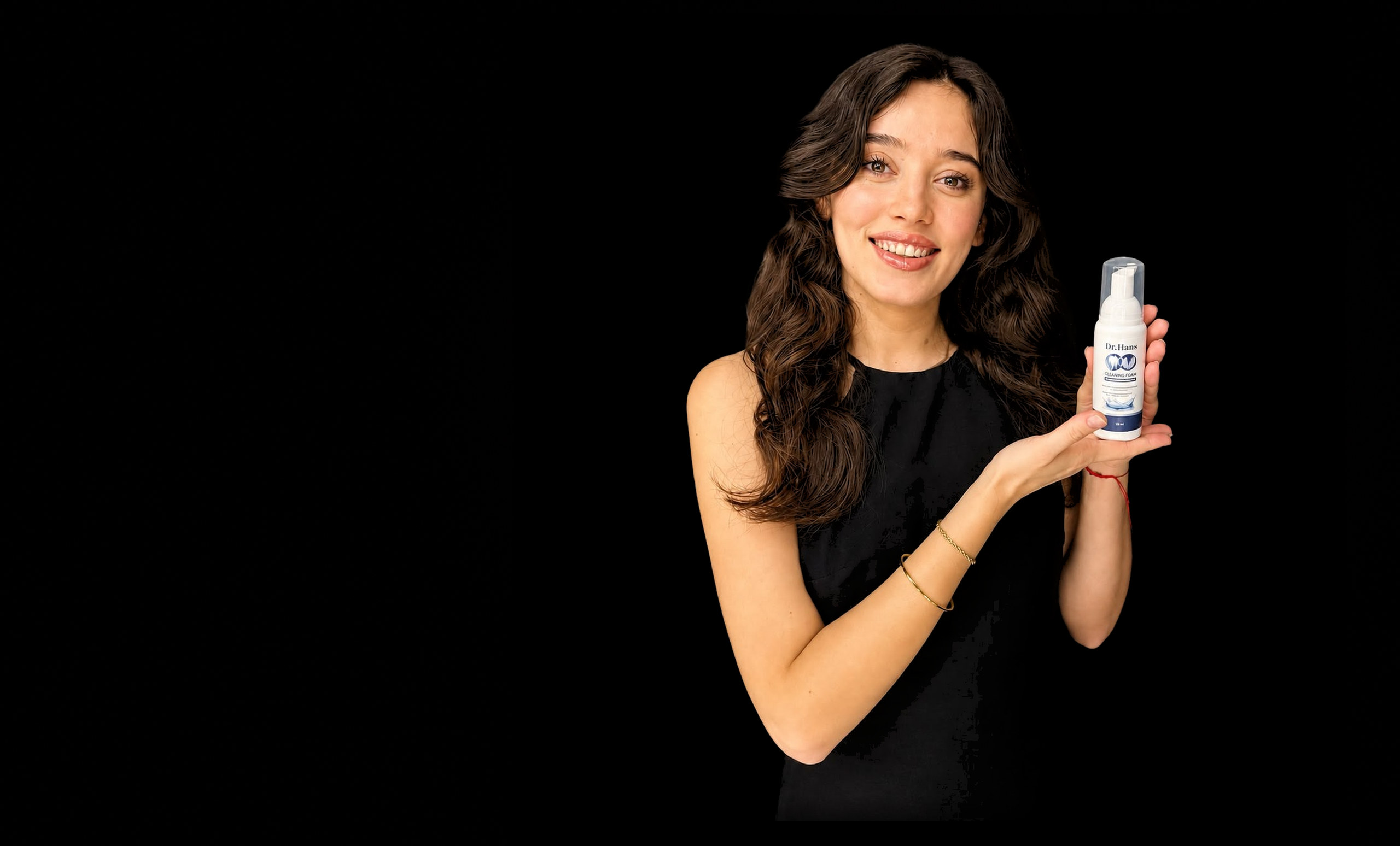 Smiling woman showing Dr.Hans tooth cleaning foam