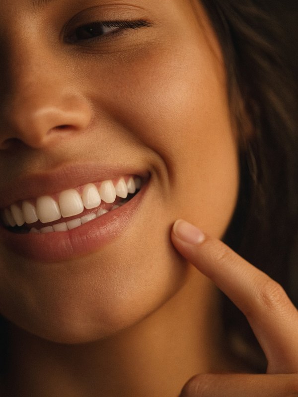 Smiling woman, gentle care for sensitive gums
